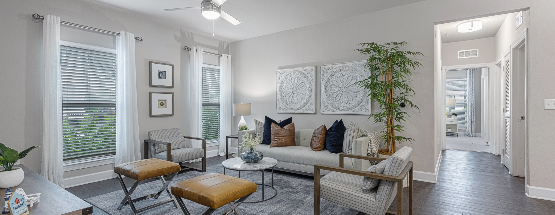 a living room with a couch and chairs