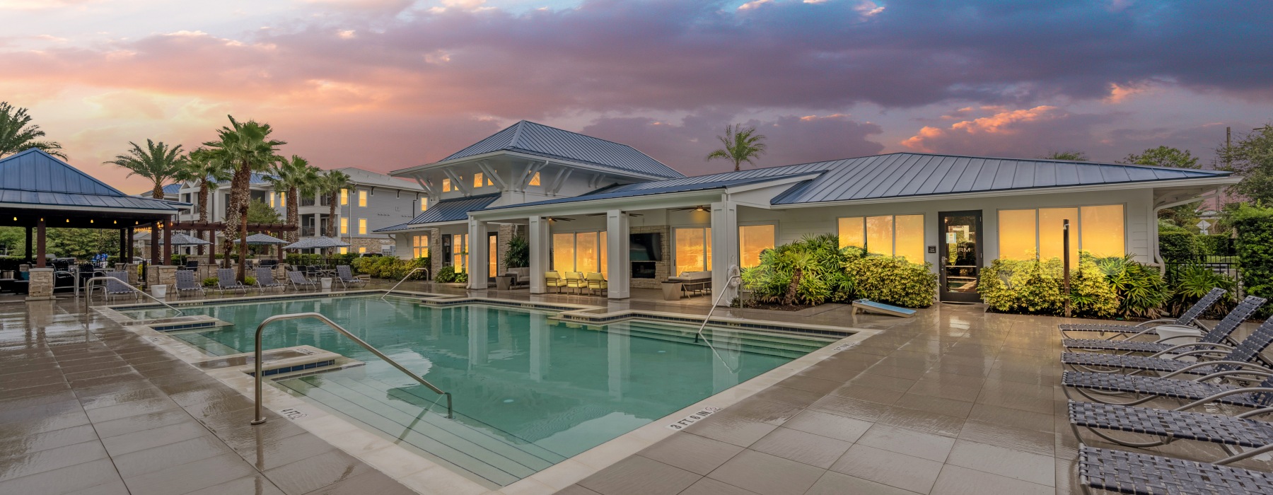 a swimming pool outside of a club house