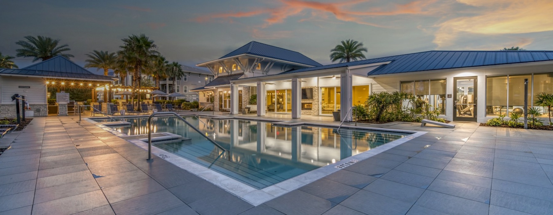Resort-style swimming pool with lounge seating
