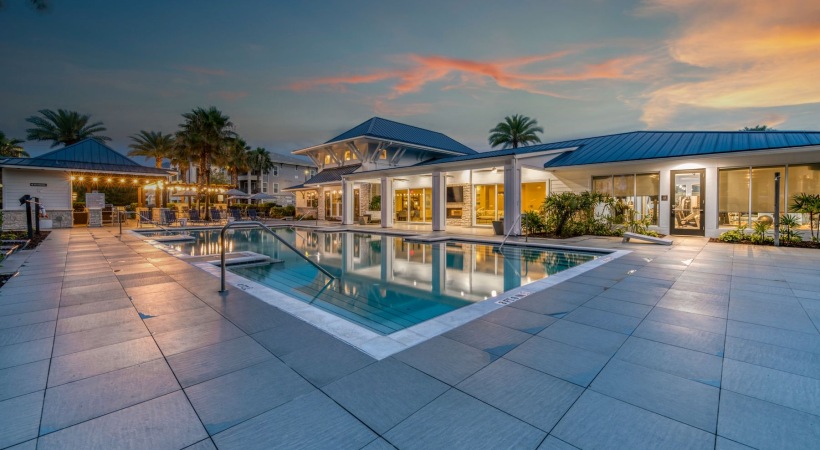 Resort-style swimming pool with lounge seating