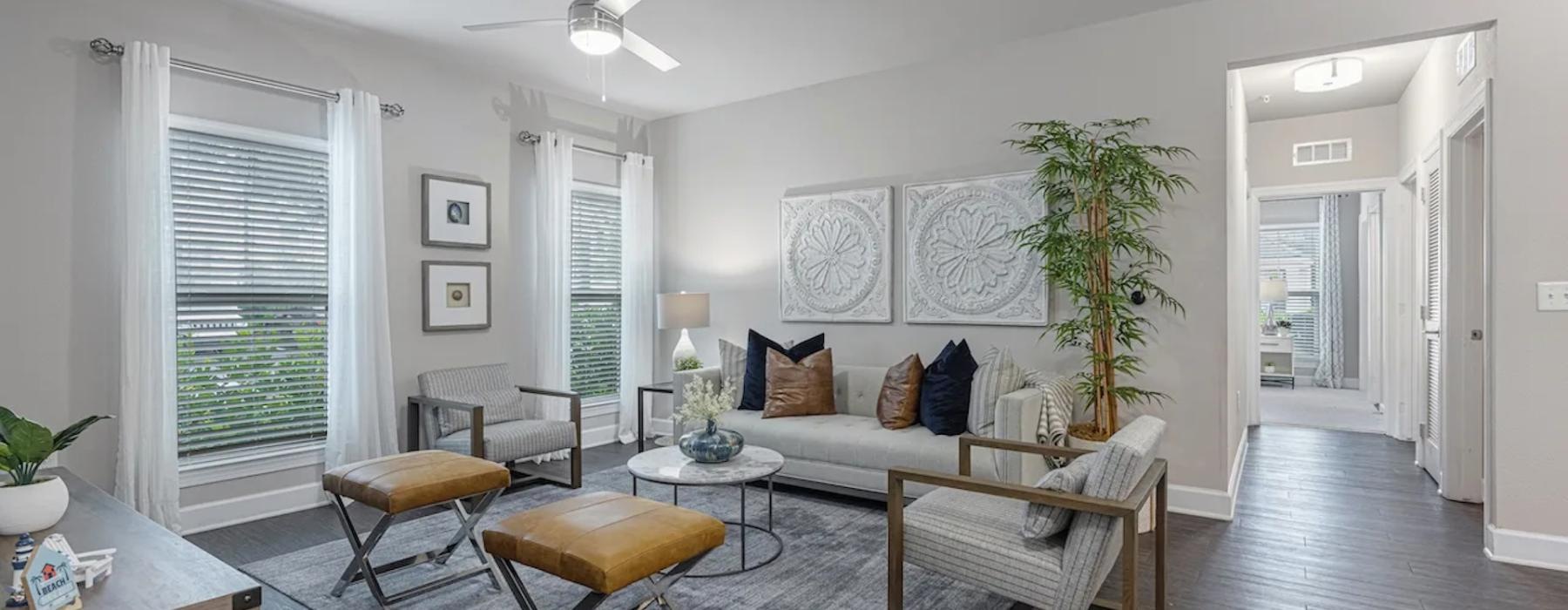 a living room with a couch and chairs