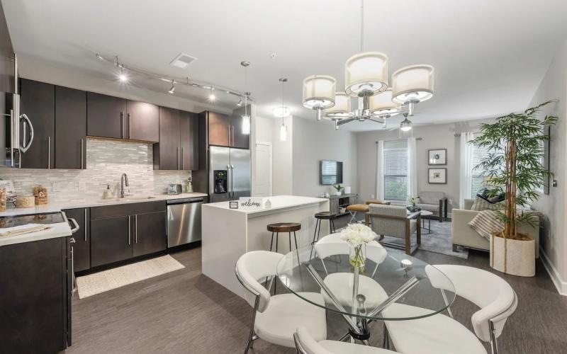 a kitchen with a dining table and chairs
